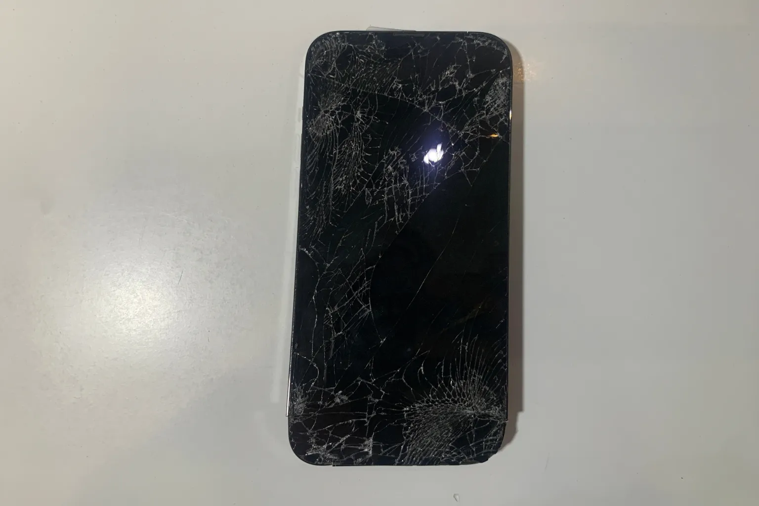 iPhone with a cracked screen